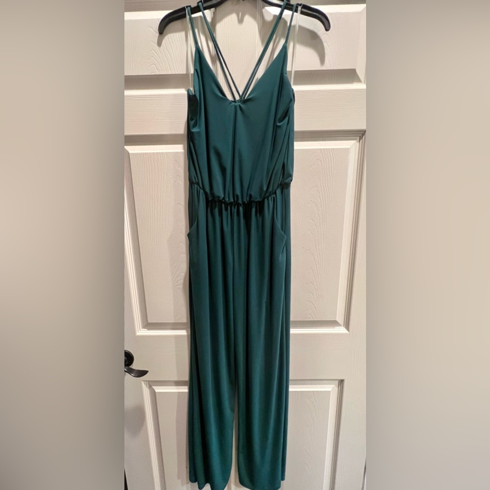 Green jumpsuit with pockets